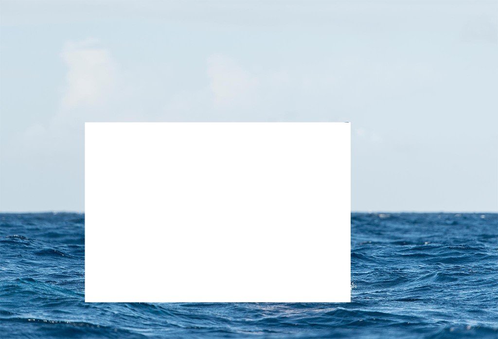 view of the sea. Where one might expect to see a swimmer or a ship, there is a black area blocking the view.